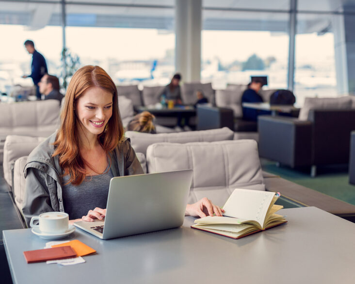 Woman Working in Airport Lounge
