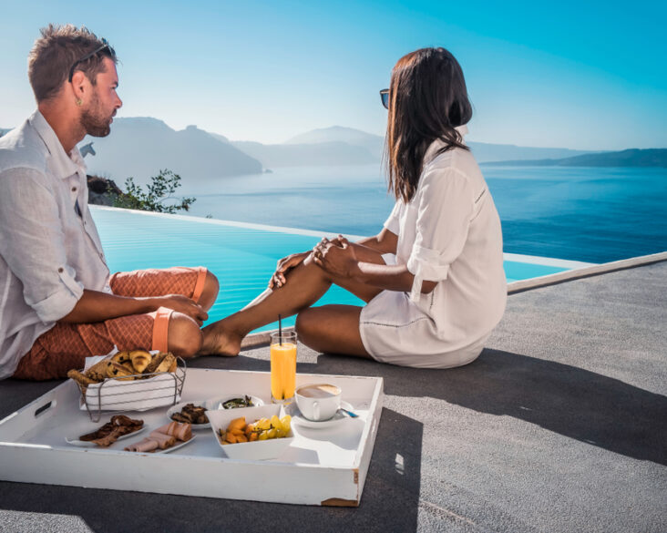 couple eating breakfast poolside